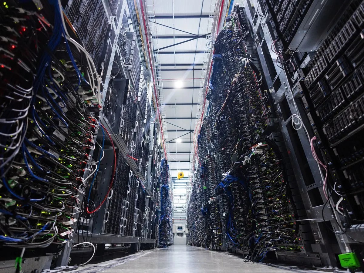 Rows of densely cabled server racks inside a data centre hall